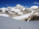 Rolwaling 07 14 Takargo Above Drolambau Glacier From Tashi Lapcha Pass I reached the top of the Tashi (Tesi) Lapcha pass (5755m) after a grueling 90 minute ascent on the steep snow slope. Takargo (Dragker-Go, 6793m) shone in the mid-day sun in the view west from the Tashi (Tesi) Lapcha pass, with the rest of my crew still struggling upwards. Takargo was opened for climbing in 2003.